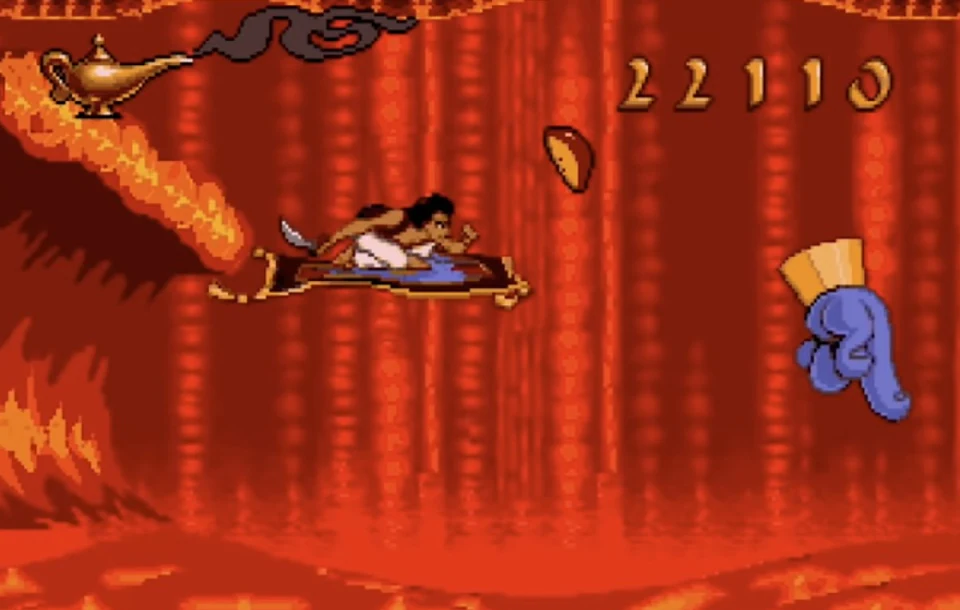 Aladdin riding the magic carpet through the red lava tunnel during the SNES Cave of Wonders escape