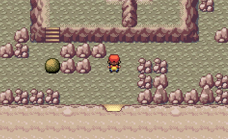 Pokemon FireRed trainer beside a movable boulder inside Victory Road first floor