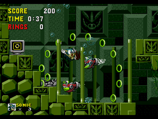 Sonic underwater among stone pillars and fish enemies in Sonic the Hedgehog Labyrinth Zone