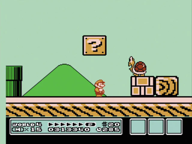 Mario beside a giant Koopa Troopa and oversized blocks in Super Mario Bros 3 Giant Land