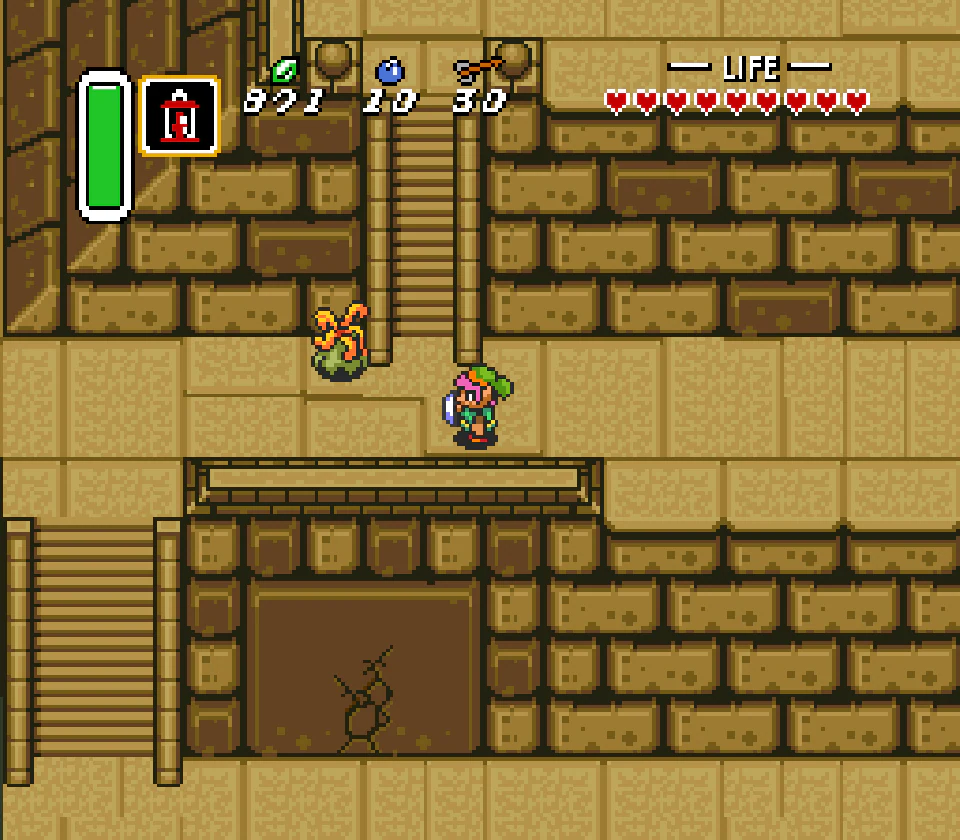 Link facing a jumping enemy beside a staircase in the Palace of Darkness in A Link to the Past